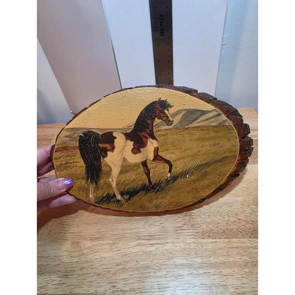 decoupaged craft plaque featuring a brown and white pinto horse on an oval wood